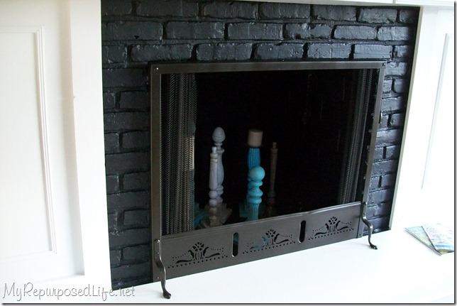 I got this ugly brass fireplace screen at a thrift store for $4. I used spray paint to give it a great new look for my fireplace. Easy spray paint projects